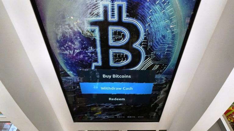 In this Feb. 9, 2021 file photo, the Bitcoin logo appears on the display screen of a crypto currency ATM at the Smoker’s Choice store in Salem, N.H. (AP Photo / Charles Krupa, File)