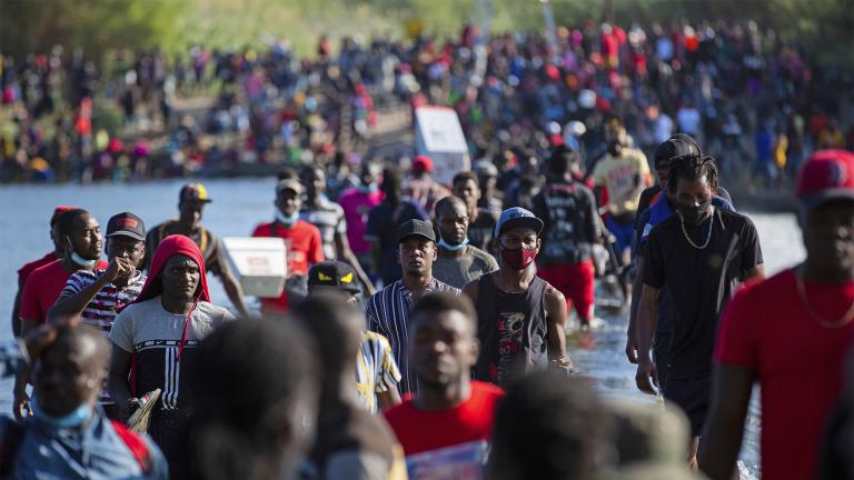Haiti migrants waiting in Del Rio and Ciudad Acuña to get access to the United States, cross the Rio Grande toward Ciudad Acuña to get supplies, Friday, Sept. 17, 2021, in Ciudad Acuña, Mexico. (Marie D. De Jesús / Houston Chronicle via AP) 