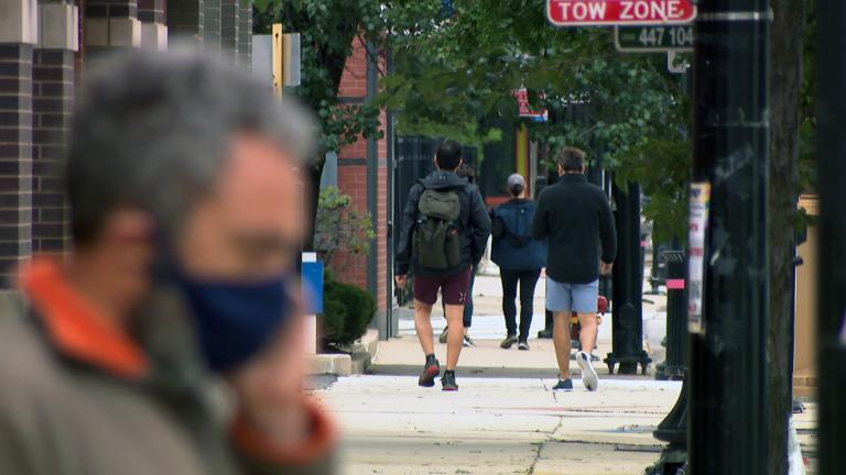 People walk in Chicago’s Northalsted neighborhood in September 2020. (WTTW News)