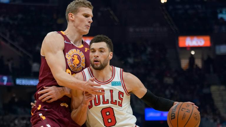 Chicago Bulls’ Zach LaVine (8) drives against Cleveland Cavaliers’ Lauri Markkanen (24) in the first half of an NBA basketball game, Wednesday, Dec. 8, 2021, in Cleveland. (AP Photo / Tony Dejak)