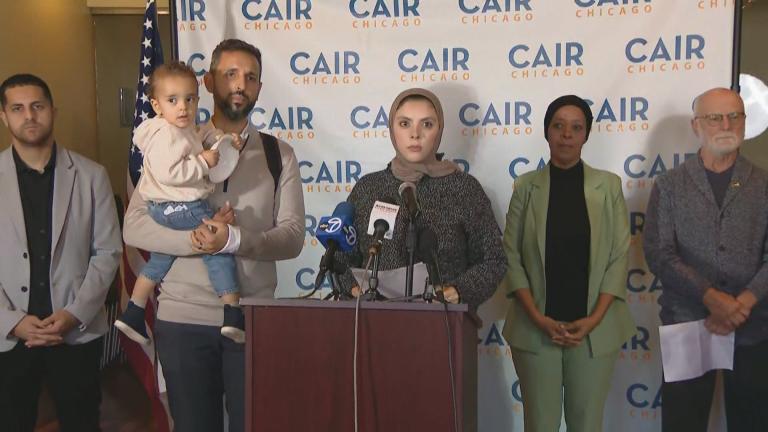 Chicago-area resident Rajaa Alrayyes is joined by health care workers during a press conference at CAIR-Chicago in the Loop on October 2, 2024. (WTTW News)