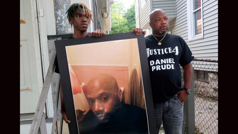 In this Sept. 3, 2020, file photo, Joe Prude, right, brother of Daniel Prude, and Daniel's nephew Armin, stand with a picture of Daniel Prude in Rochester, N.Y. (AP Photo / Ted Shaffrey, File)