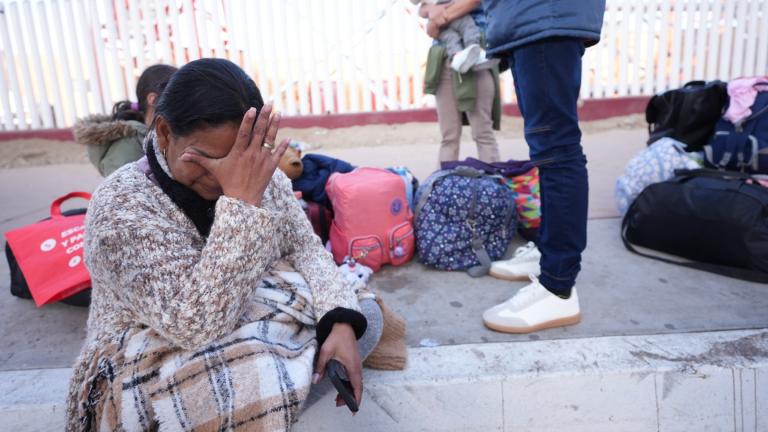 Maria Mercado, who is from Colombia but arrived from Ecuador, gets emotional as she sees that her 1pm appointment was canceled on the U.S. Customs and Border Protection (CBP) One app, as she and her family wait at the border crossing in Tijuana, Mexico on Monday, Jan. 20. 2025. (AP Photo / Gregory Bull)