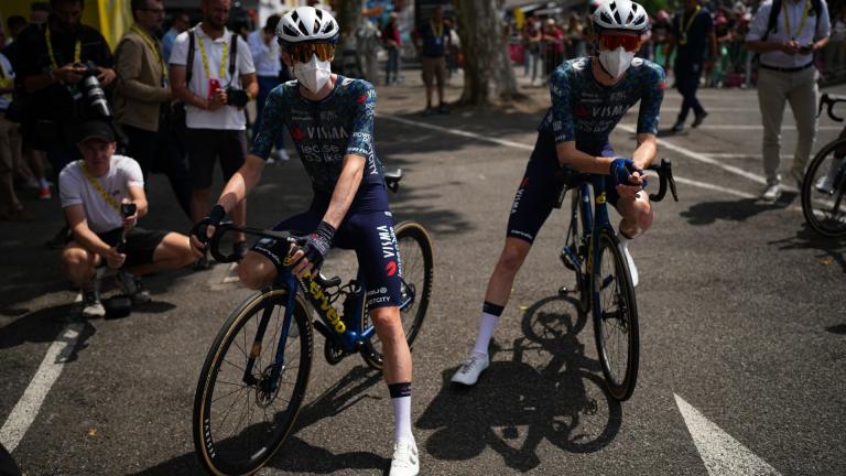 Denmark's Jonas Vingegaard, left, and teammate Matteo Jorgenson, of the U.S., wear face masks to protect themselves from the Corona virus prior to the start of the fourteenth stage of the Tour de France cycling race over 151.9 kilometers (94.4 miles) with start in Pau and finish in Saint-Lary-Soulan Pla d'Adet, France, July 13, 2024. (AP Photo / Daniel Cole, File)