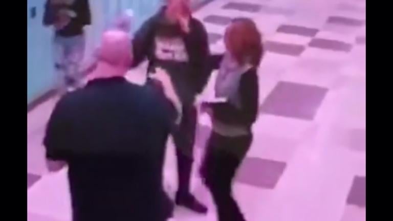 A still image from a video provided to WTTW News allegedly shows Lincoln Park High School leader Judith Gibbs grabbing a student. Gibbs decided to leave the school Wednesday. (WTTW News)