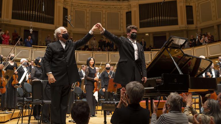 Guest conductor Manfred Honeck and Denis Matsuev acknowledge the audience following a performance of Prokofiev Piano Concerto No. 3 with the Chicago Symphony Orchestra. (Todd Rosenberg Photography)