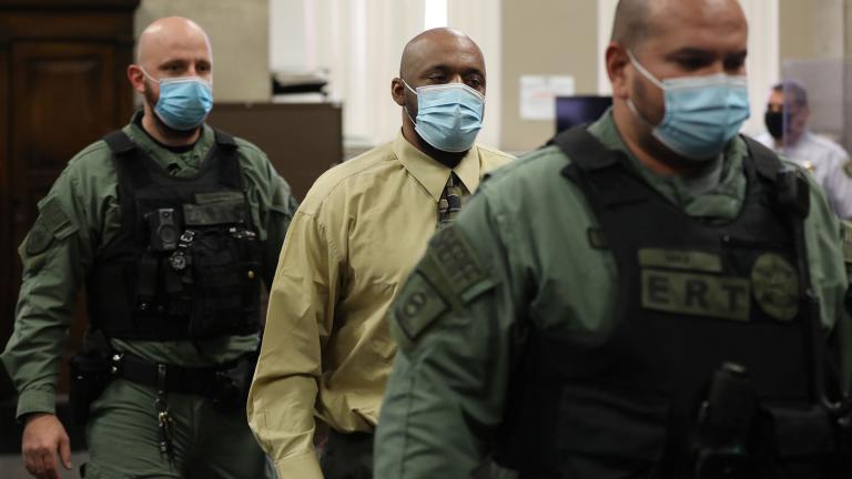 Escorted out by sheriff deputies, Shomari Legghette stands to leave his sentencing hearing on Tuesday, Oct. 28, 2020 for the murder of Chicago police Commander Paul Bauer in 2018. (Antonio Perez / Chicago Tribune / Pool)