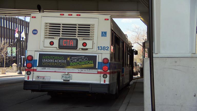 A CTA bus picks up passengers in Chicago. (WTTW News)