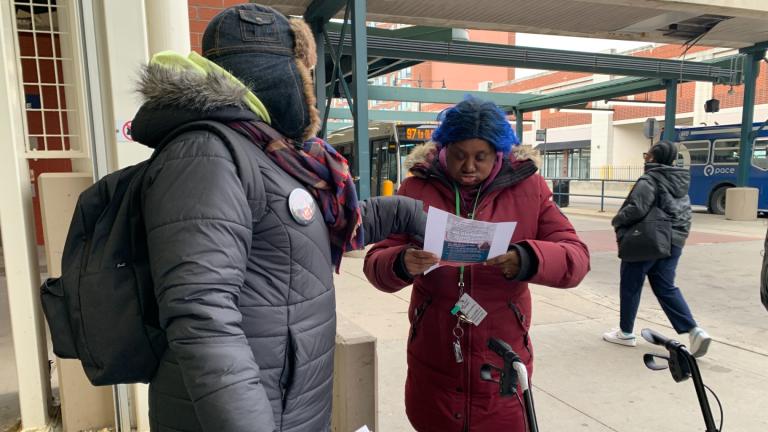 Left, Brandy Leach, a unionized CTA switch person, speaks with a transit rider on March 26, 2025, at the Howard ‘L’ station in support of a proposal to reform the Chicago area’s public transit systems. (Eunice Alpasan / WTTW News)