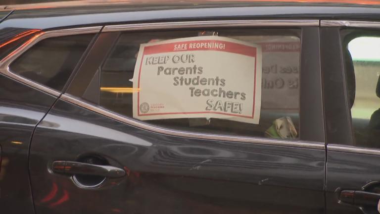A sign supporting the Chicago Teachers Union during its car caravan rally on Wednesday, Jan. 5, 2022. (WTTW News)