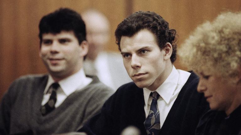 Lyle, left, and Erik Menendez sit with defense attorney Leslie Abramson, right, in Beverly Hills Municipal Court during a hearing, Nov. 26, 1990. (AP Photo / Nick Ut, File)