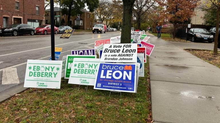 Campaign signs are pictured outside of a Chicago polling place on Nov. 5, 2024. (Blair Paddock / WTTW News)