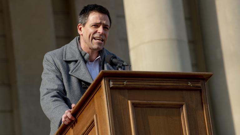 Ryan Kelley, a Republican gubernatorial candidate, speaks to conservative activists that are demanding another investigation into former President Donald Trump’s loss during a rally on Feb. 8, 2022 outside the Michigan Capitol in Lansing, Mich. (Jake May/The Flint Journal via AP)