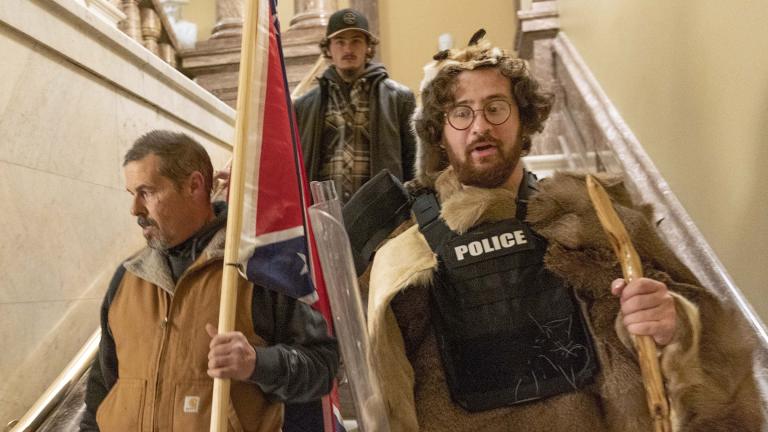 In this Jan. 6, 2021 file photo, insurrectionists loyal to President Donald Trump, including Aaron Mostofsky, right, and Kevin Seefried, left, walk down the stairs outside the Senate Chamber in the U.S. Capitol, in Washington. (AP Photo / Manuel Balce Ceneta, File)
