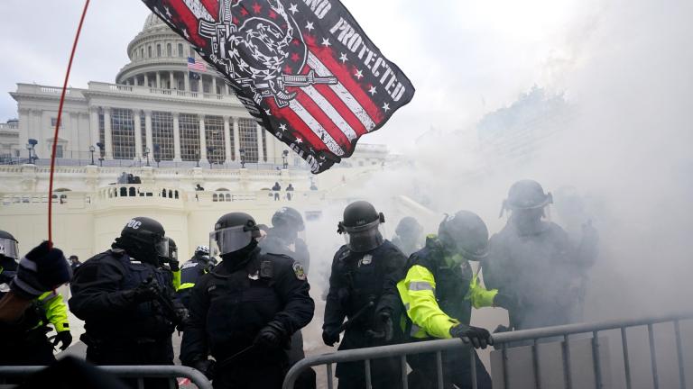 In this Jan. 6, 2021, U.S. Capitol Police officers hold off rioters loyal to President Donald Trump at the Capitol in Washington. (AP Photo / Julio Cortez, File) In this Jan. 6, 2021, U.S. Capitol Police officers hold off rioters loyal to President Donald Trump at the Capitol in Washington. (AP Photo / Julio Cortez, File)