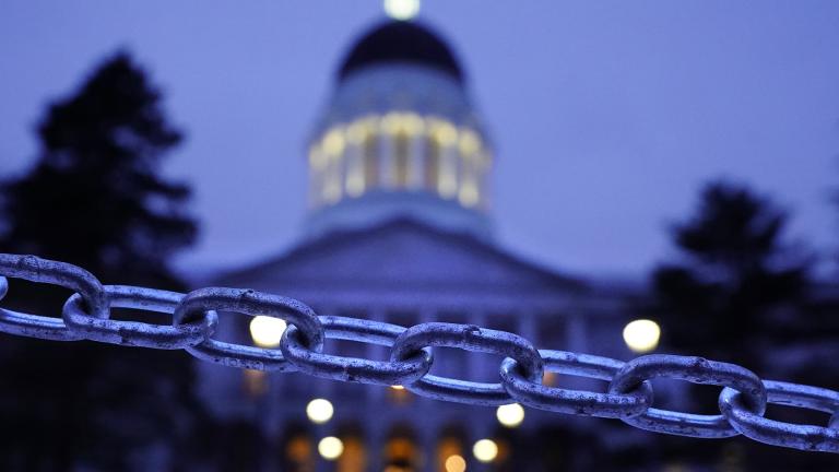 A chain blocks the sidewalk entrance to the front steps of the Maine State House, Wednesday, Jan. 13, 2021, in Augusta, Maine. (AP Photo / Robert F. Bukaty)