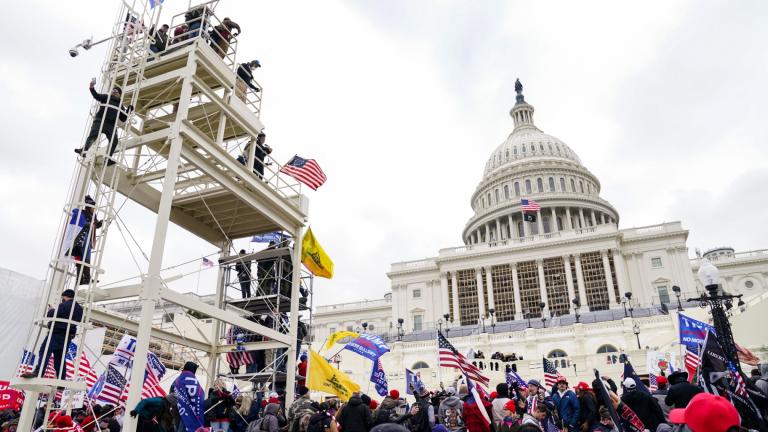 FILE - Violent insurrectionists loyal to President Donald Trump breach the U.S. Capitol in Washington, Jan. 6, 2021. (John Minchillo / AP Photo, File)