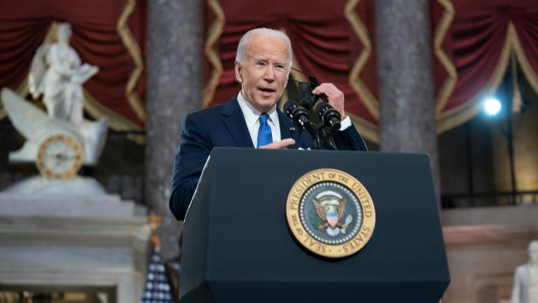 President Joe Biden takes off his face mask as he speaks from Statuary Hall at the U.S. Capitol to mark the one-year anniversary of the Jan. 6 riot at the Capitol by supporters loyal to then-President Donald Trump, Thursday, Jan. 6, 2022, in Washington. (Greg Nash / Pool via AP) President Joe Biden takes off his face mask as he speaks from Statuary Hall at the U.S. Capitol to mark the one-year anniversary of the Jan. 6 riot at the Capitol by supporters loyal to then-President Donald Trump, Thursday, Jan. 6, 2022, in Washington. (Greg Nash / Pool via AP)