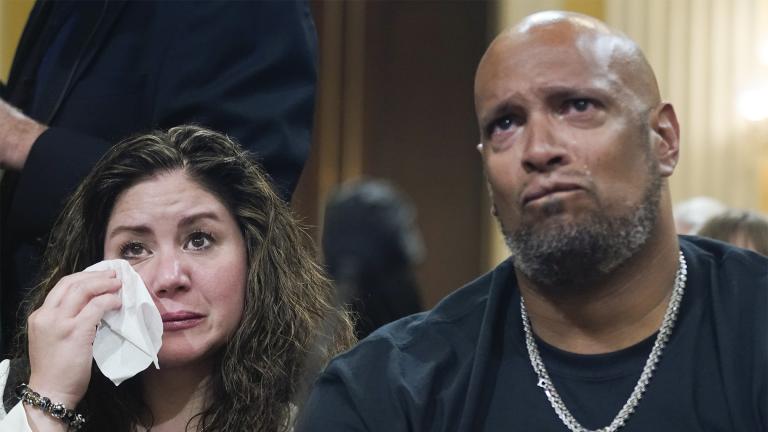 U.S. Capitol Police Sgt. Harry Dunn, right, and Sandra Garza, the long-time partner of Capitol Hill Police Officer Brian Sicknick who died shortly after the Jan. 6 attack, left, react as a video of the Jan. 6 attack on the U.S. Capitol is played during a public hearing of the House select committee investigating the attack is held on Capitol Hill, Thursday, June 9, 2022, in Washington. (AP Photo / Andrew Harnik)