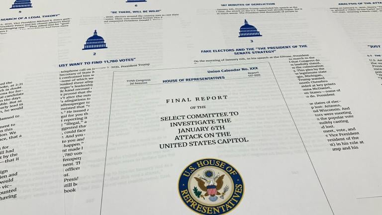 Pages from the final report released by the House select committee investigating the Jan. 6 attack on the U.S. Capitol, is photographed Thursday, Dec. 22, 2022. (AP Photo / Jon Elswick)