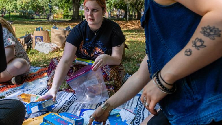 DePaul University freshman Anna Daniel, 19, assembles a kit of contraceptive supplies at Oz Park in Chicago on Sunday, Sept. 28, 2025. (AP Photo / Heidi Zeiger)