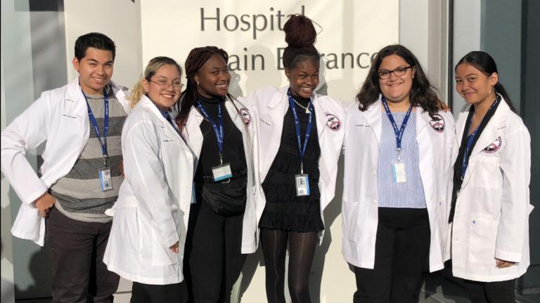 Chasity Kasir, far right, and her Health Occupations Students of America teammates had the opportunity to see a live open heart surgery. (Photo courtesy Chasity Kasir)