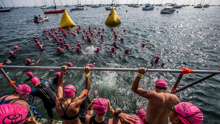 A wave of swimmers start their race in Lake Michigan at the 2015 Chicago Triathlon. (Courtesy of Transamerica Chicago Triathlon)