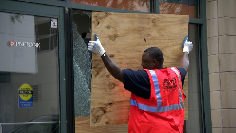 A bank is boarded up in Chicago following civil unrest and property damage in the summer of 2020. (WTTW News)