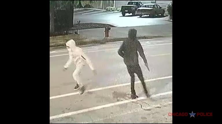 A screen shot from surveillance footage published by the Chicago Police Department shows two suspects sought in the fatal shooting of Yvonne Ruzich. (WTTW News via Chicago Police Department)