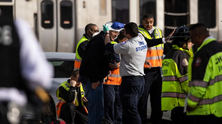 Chicago Fire Department and Chicago Police Department personnel triage patients at the scene after a Chicago Transit Authority train crashed into a piece of equipment that was on the rails near the Howard CTA station on the North Side, Thursday, Nov. 16, 2023 in Chicago. (Ashlee Rezin /Chicago Sun-Times via AP)