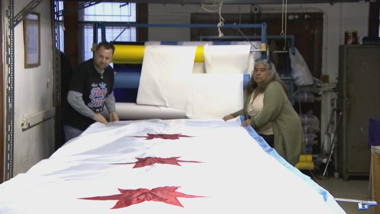 W.G.N. Flag and Decorating Company employees make a Chicago flag. (WTTW News)