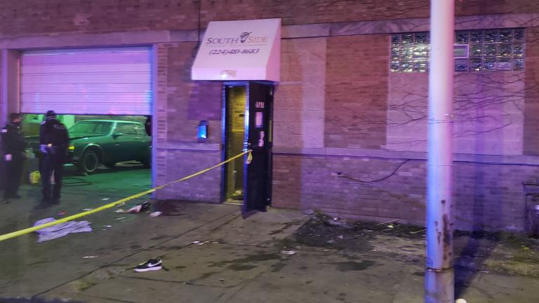 This photo provided by the Chicago Fire Department shows police investigating the scene of a shooting early Sunday, March 14, 2021 in the Park Manor neighborhood in Chicago. (Chicago Fire Department / Chicago Sun-Times via AP)