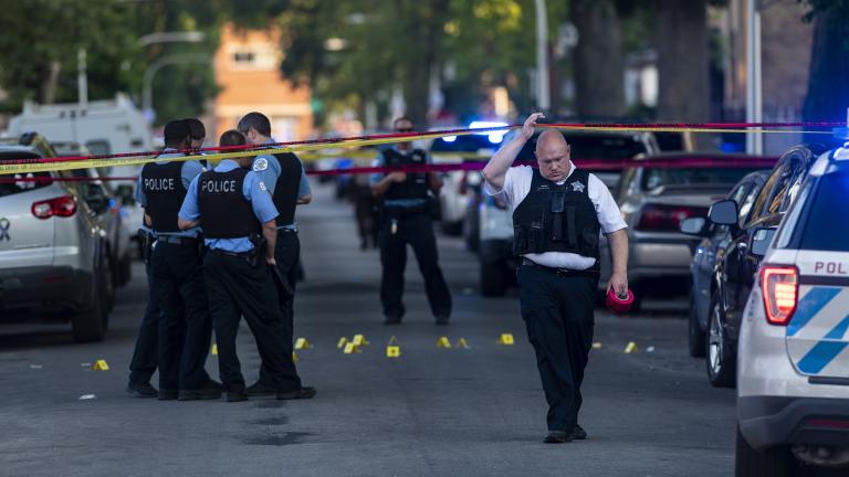 Chicago police officers investigate the scene of a deadly shooting where a 7-year-old girl and a man were fatally shot in Chicago on Sunday, July 5, 2020. (Tyler LaRiviere / Chicago Sun-Times via AP)