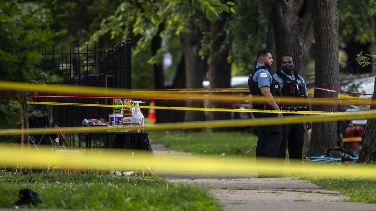 Chicago police investigate the scene where multiple people were shot in the 8200 block of South Drexel, in the Chatham neighborhood of Chicago, Friday, July 17, 2020. (Tyler LaRiviere / Chicago Sun-Times via AP)