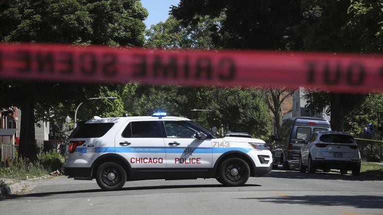 Police tape marks off a Chicago street as officers investigate the scene of a fatal shooting in the city's South Side on Tuesday, June 15, 2021. An argument in a house erupted into gunfire early Tuesday, police said. (AP Photo / Teresa Crawford)
