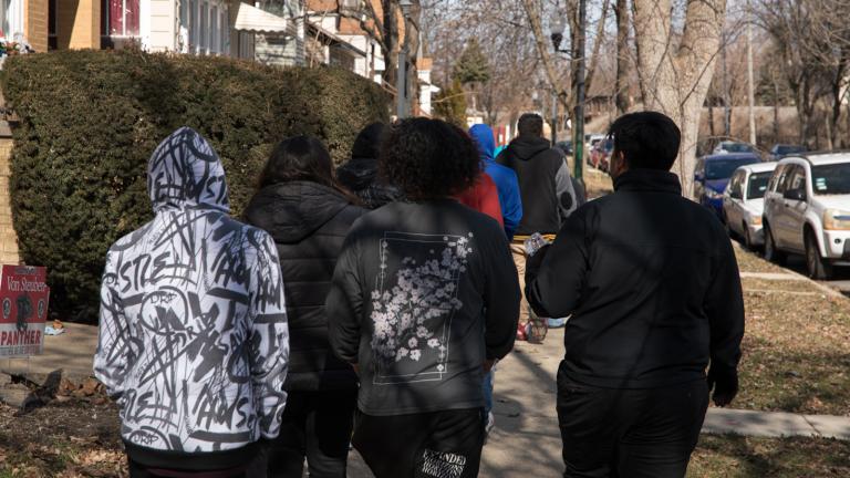 On Feb. 21, 2023, A group of Kelvyn Park High School seniors walk down Kostner Avenue to an early polling location at Kilbourn Park as part of a Chicago Votes “Parade to the Polls” initiative to register students to vote and cast their ballot. (Michael Izquierdo / WTTW News)