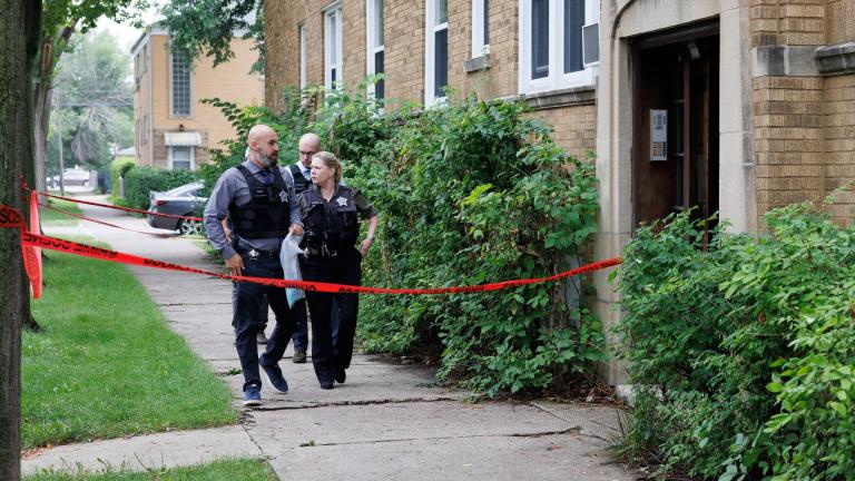 Police investigate the apartment building of the shooter at the scene where an 8-year-old Chicago girl was killed in Portage Park, Sunday, Aug. 6, 2023. (Anthony Vazquez / Chicago Sun-Times via AP)