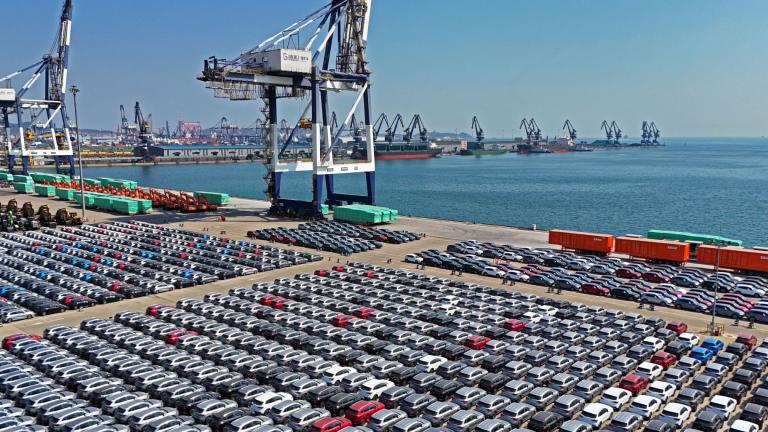 An aerial view of new cars waiting for shipment at a pier for ro-ro ships in Yantai city in eastern China's Shandong province Sunday, March 30, 2025. (Chinatopix Via AP) 