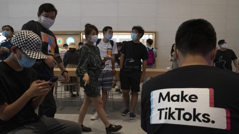 A visitor to an Apple store wears a T-shirt promoting TikTok in Beijing on Friday, July 17, 2020. (AP Photo / Ng Han Guan)
