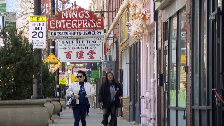 A file photo of people walking down the street in Chinatown. (WTTW News)