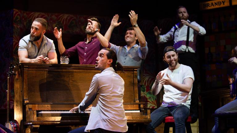 From left: Tom Brandon, John Sheehy, Connor Going (at piano), Andrew Carter, Denis Grinden (seated) and Mark Loveday in “The Choir of Man.” (Credit: Brian Wright)