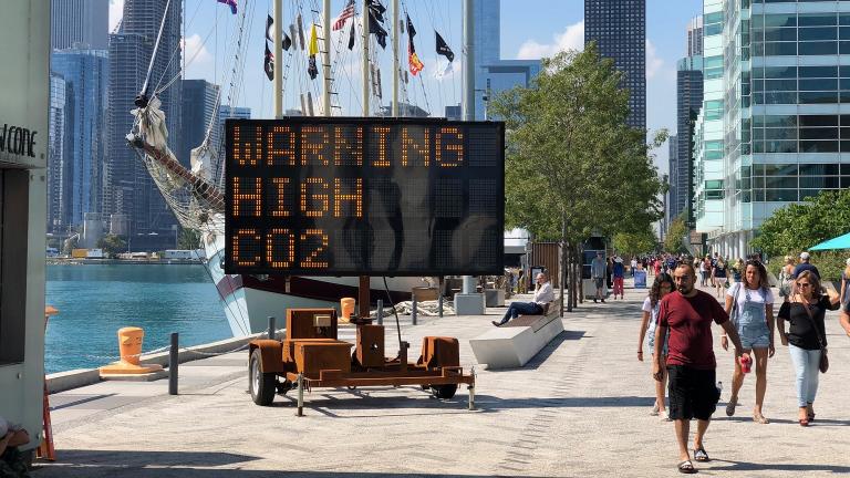 A new art installation at Navy Pier uses a solar-powered highway message board to warn of the dangers of climate change. (Alex Ruppenthal / Chicago Tonight)