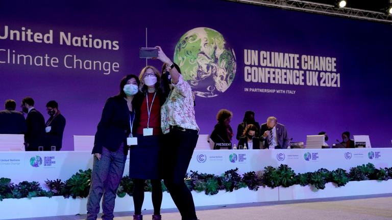 Delegates pose for a selfie together in the plenary room at the COP26 U.N. Climate Summit, in Glasgow, Scotland, Saturday, Nov. 13, 2021. (AP Photo / Alberto Pezzali)