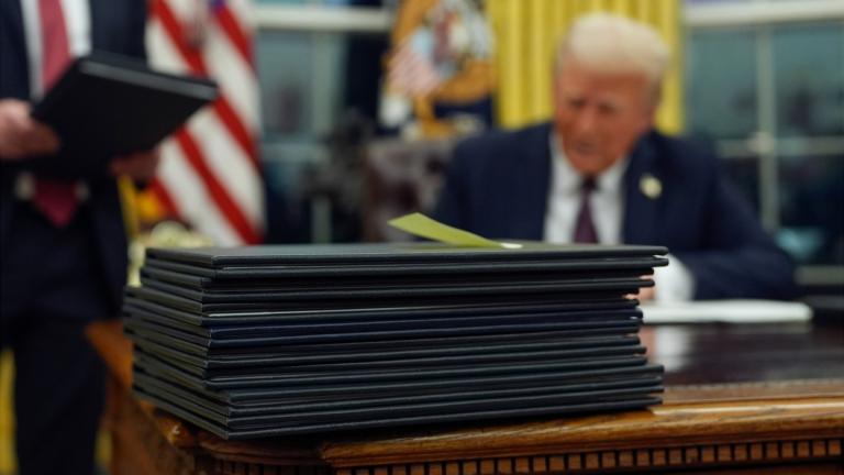 FILE - President Donald Trump signs executive orders in the Oval Office of the White House, Jan. 20, 2025, in Washington. (Evan Vucci / AP Photo, File)