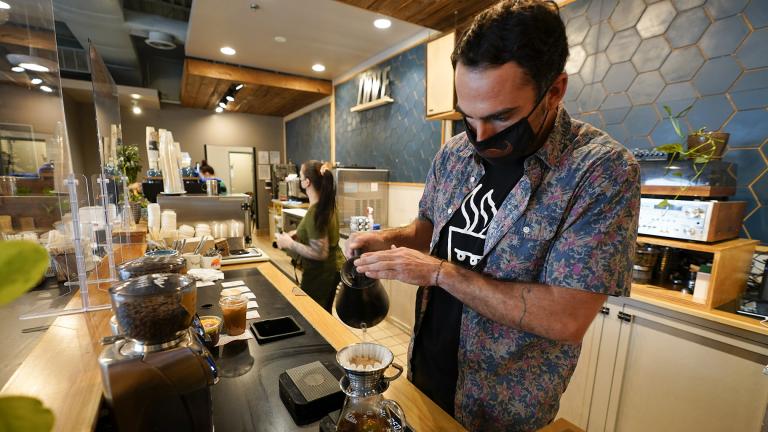 Chris Vigilante makes a dripped coffee for a customer at one of his coffee shops, Wednesday, Sept. 1, 2021, in College Park, Md. (AP Photo / Julio Cortez)