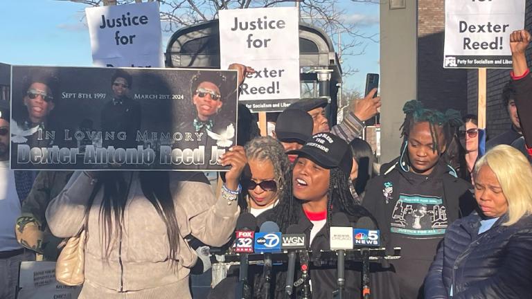 Community members gather outside the 11th District police headquarters on April 9, 2024, hours after video of the fatal police shooting of Dexter Reed was released. (Heather Cherone / WTTW News)