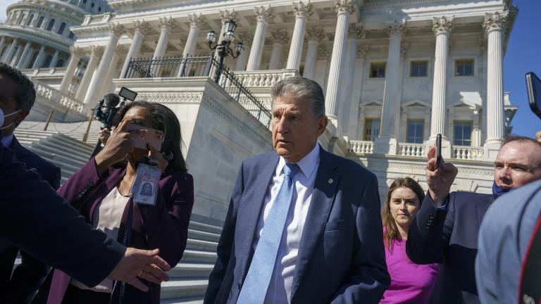 Sen. Joe Manchin, D-W.Va., a centrist Democrat vital to the fate of President Joe Biden’s $3.5 trillion domestic agenda, is surrounded by reporters outside the Capitol in Washington, Wednesday, Sept. 29, 2021. (AP Photo / J. Scott Applewhite)