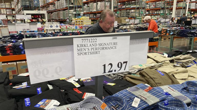 A sign displays the price for shirts as a shopper peruses the offerings at a Costco warehouse on Thursday, June 17, 2021, in Lone Tree, Colo. (AP Photo / David Zalubowski)