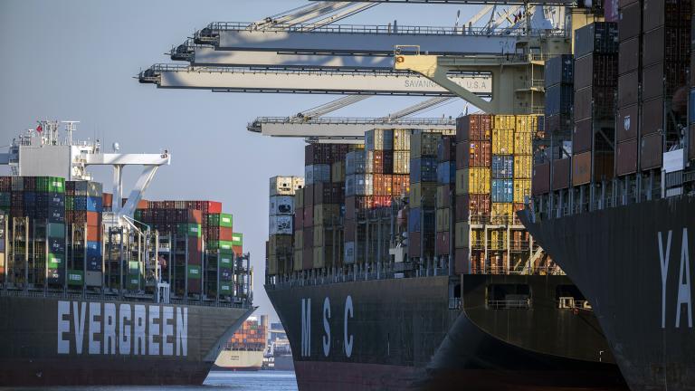 Container ship Ever Far, left, sails down river past the Georgia Ports Authority's Port of Savannah, Wednesday, Sept. 29, 2021, in Savannah, Ga. (AP Photo/Stephen B. Morton)