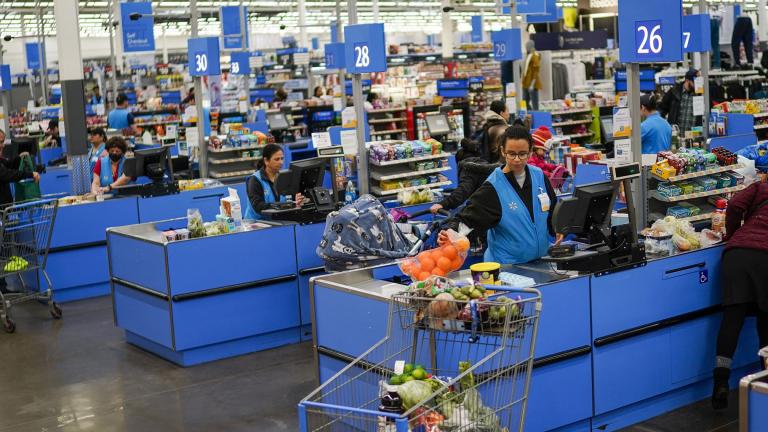 Cashiers process purchases at a Walmart Supercenter in North Bergen, N.J., on Thursday, Feb. 9, 2023. (AP Photo / Eduardo Munoz Alvarez)